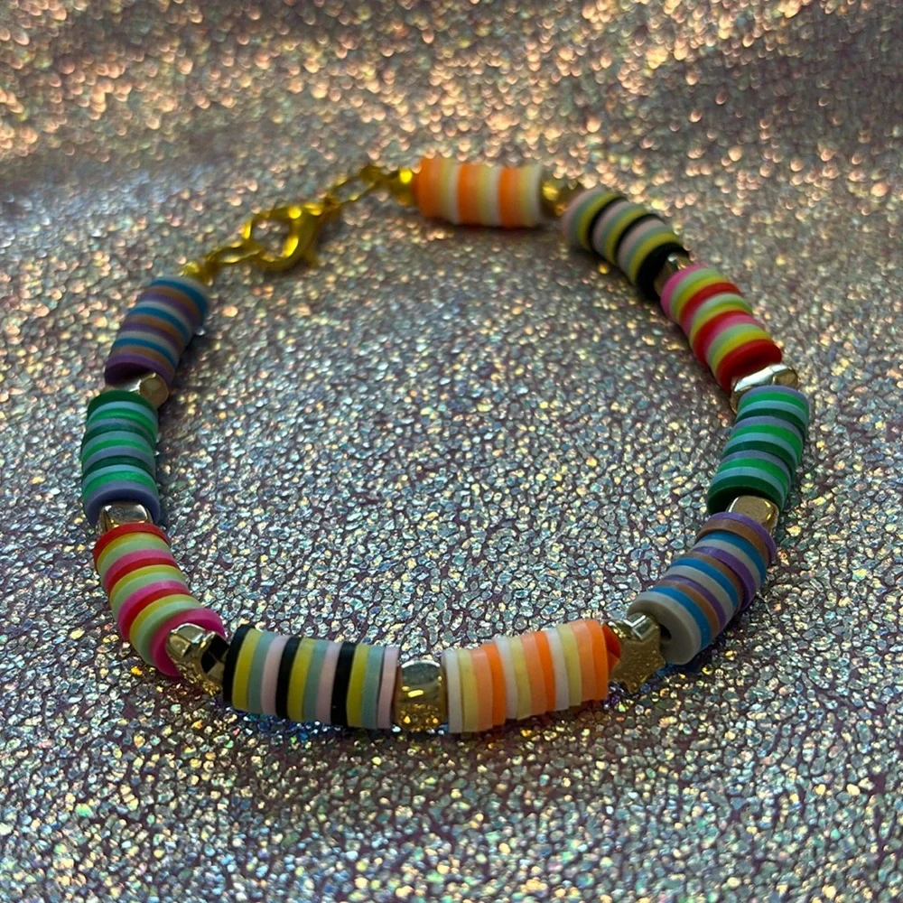 Girls multi colored clay beads bracelet with gold star and block charms. - Picture 2 of 6